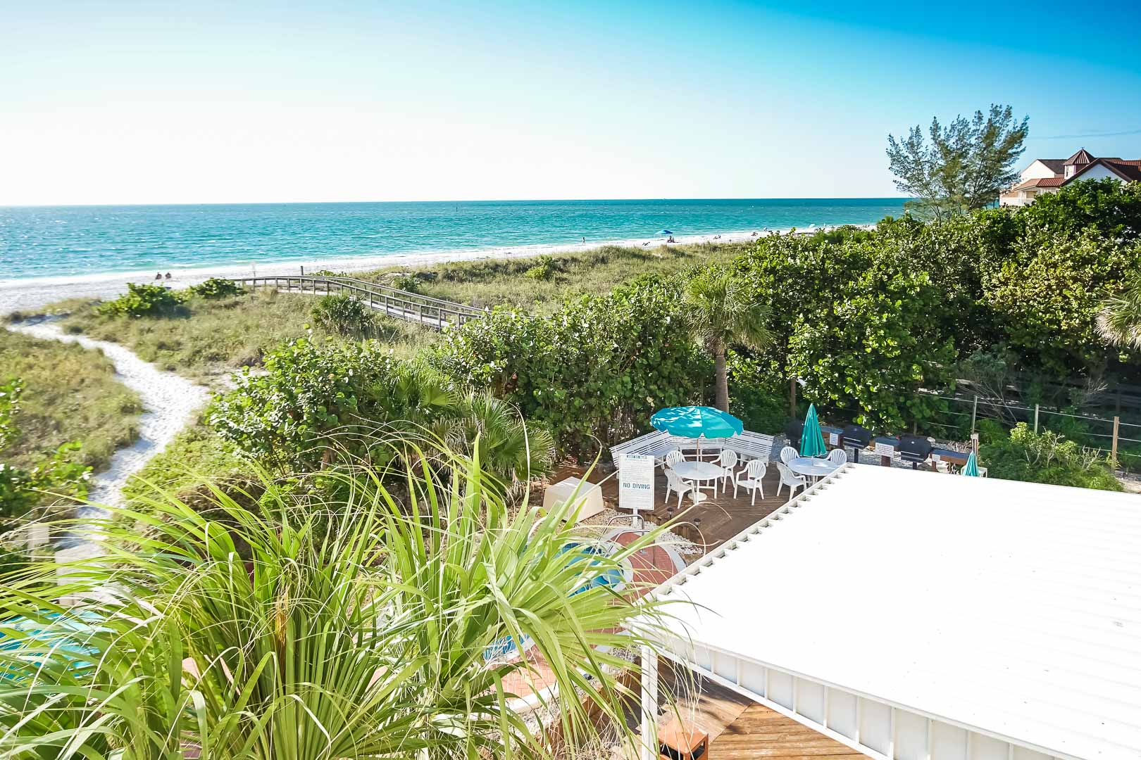 A scenic view of the beach at VRI's Sand Pebble Resort in Treasure Island, Florida.